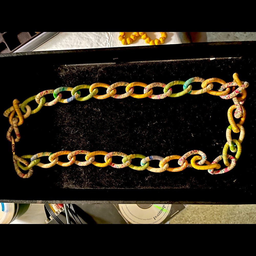 Alexis Bittar silk fabric necklace over metal chain links. Long length.